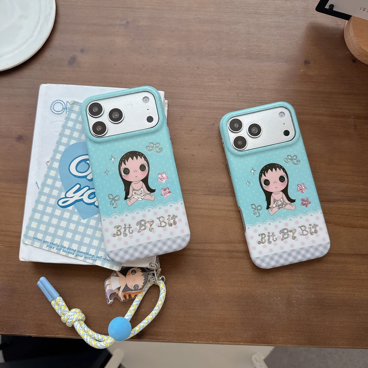 Kawaii Bit By Bit phone case with cute doll print and pastel blue design for iPhone 17 16 15 Pro Max
