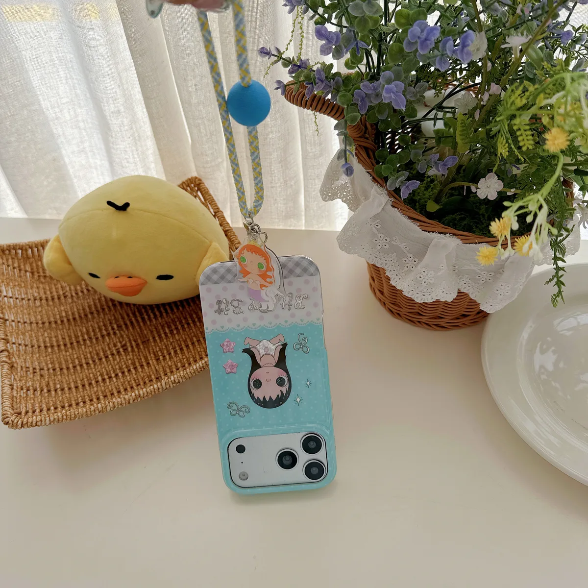 Kawaii Bit By Bit phone case with cute doll print and pastel blue design for iPhone 17 16 15 Pro Max