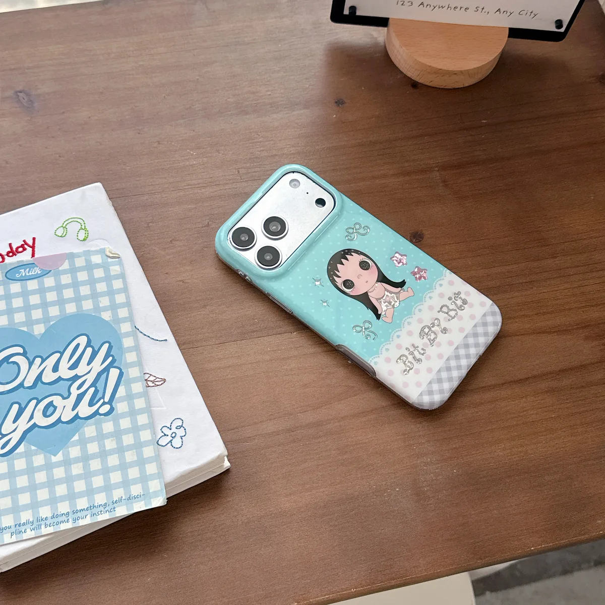 Kawaii Bit By Bit phone case with cute doll print and pastel blue design for iPhone 17 16 15 Pro Max