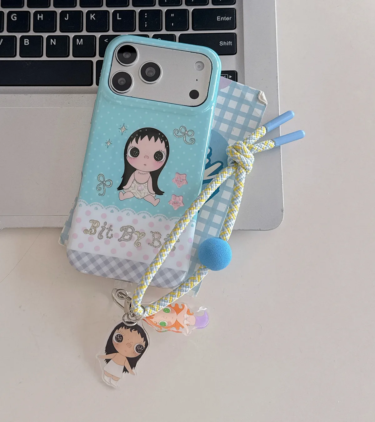 Kawaii Bit By Bit phone case with cute doll print and pastel blue design for iPhone 17 16 15 Pro Max