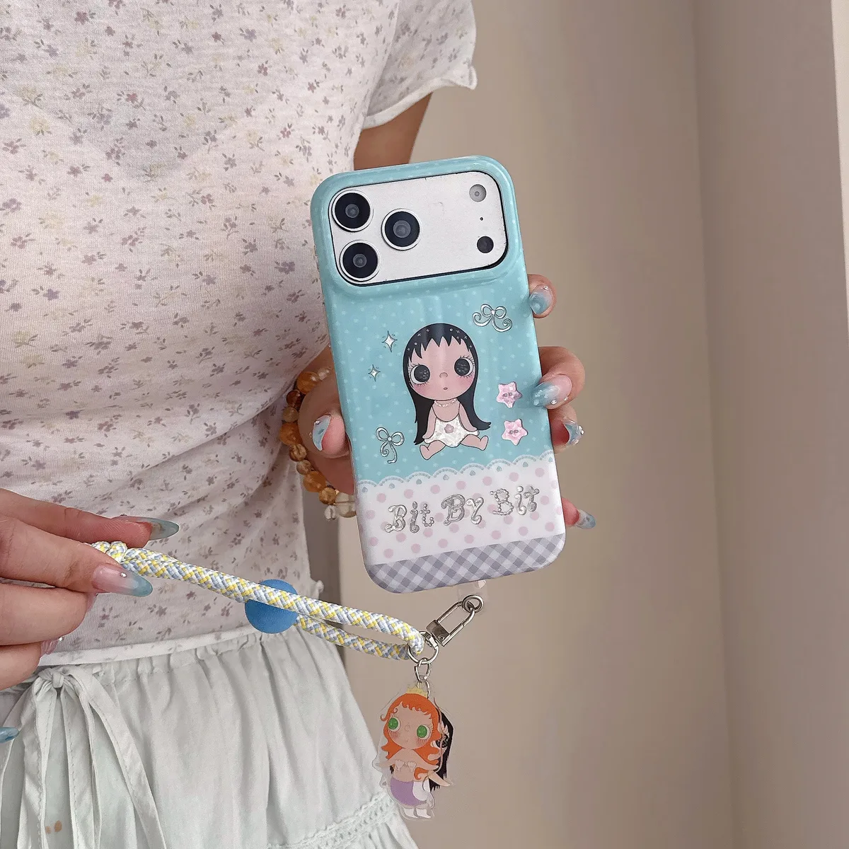 Kawaii Bit By Bit phone case with cute doll print and pastel blue design for iPhone 17 16 15 Pro Max