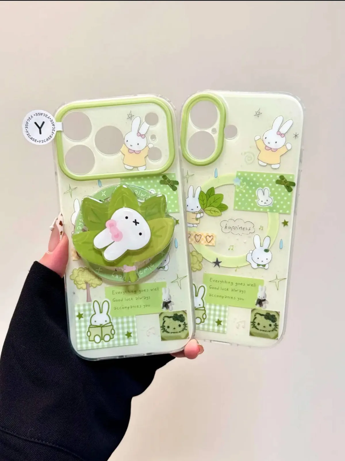 Clear green Miffy phone case with bunny graphics and a raised leaf-shaped 3D charm