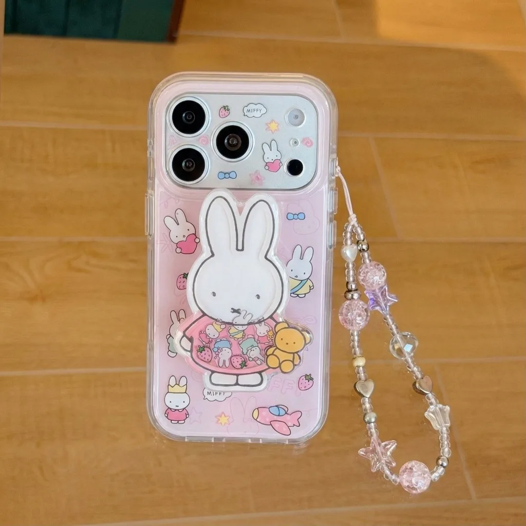 Clear pink Miffy phone case with a large Miffy figure and pastel beaded charm