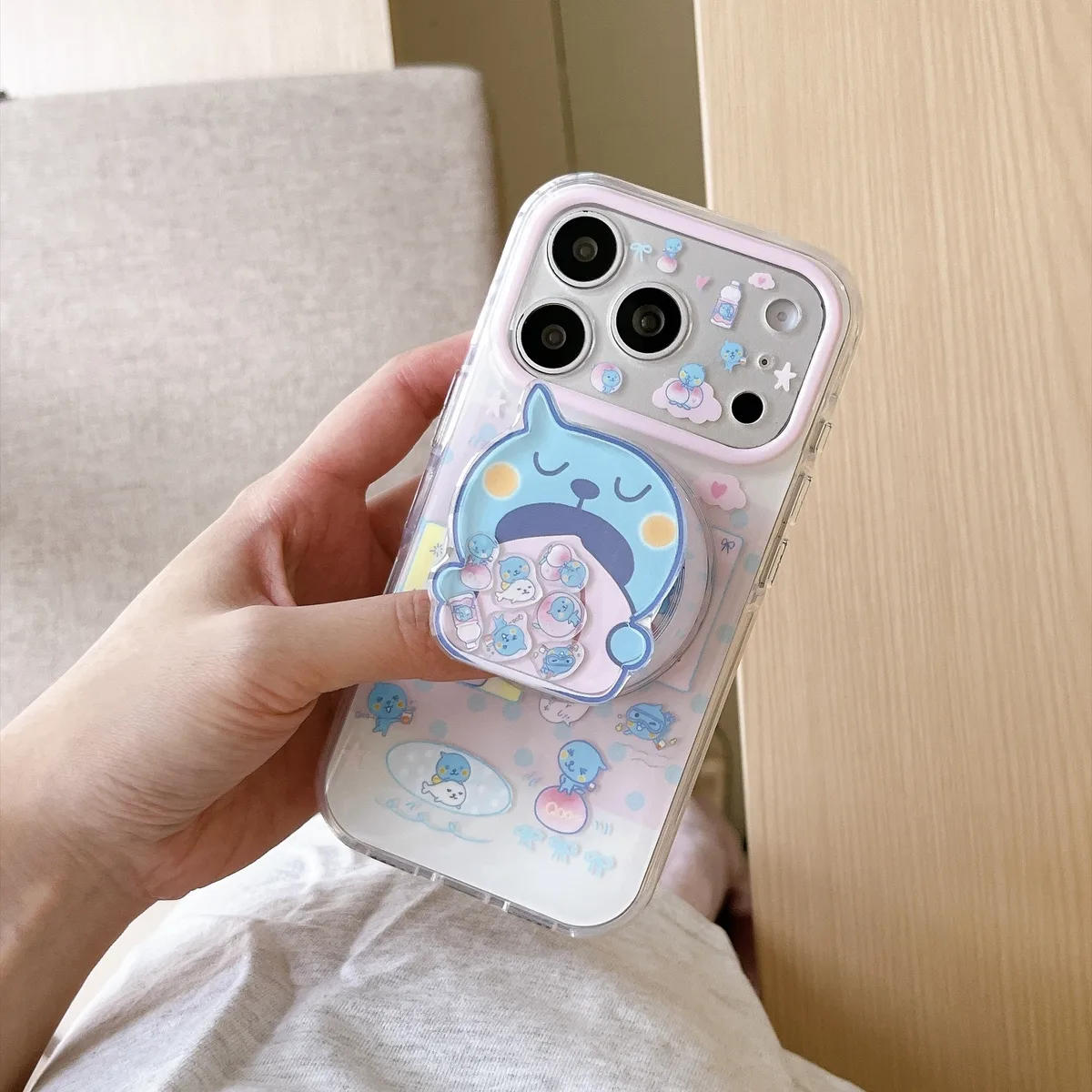 Cute blue bear clear phone case with beaded charm and pop-out grip for iPhone 17 16 15 Pro Max — MagSafe