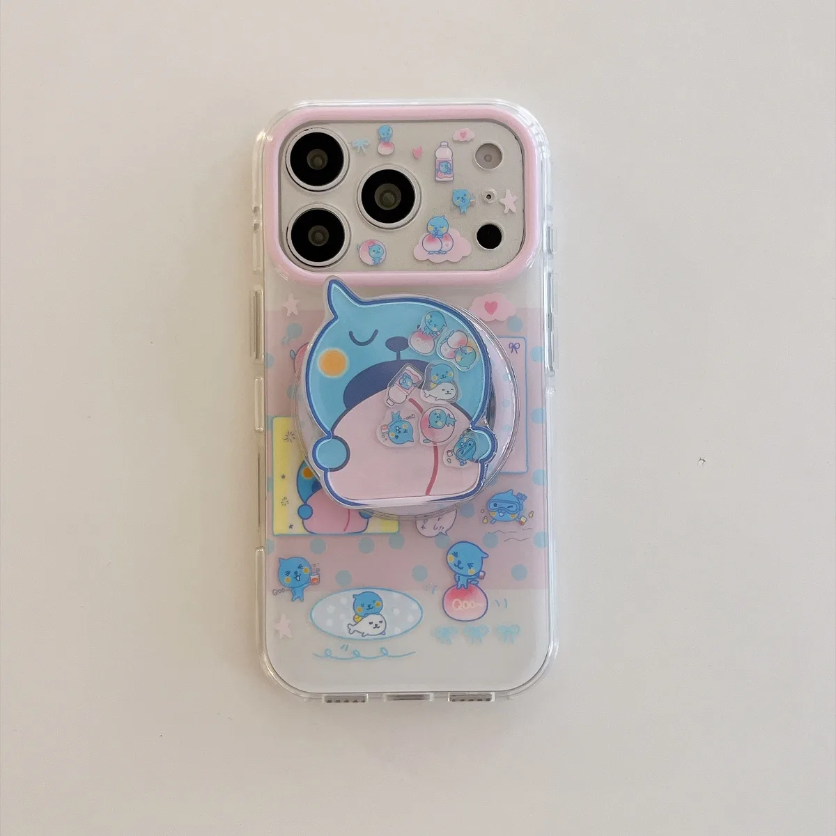 Cute blue bear clear phone case with beaded charm and pop-out grip for iPhone 17 16 15 Pro Max — MagSafe