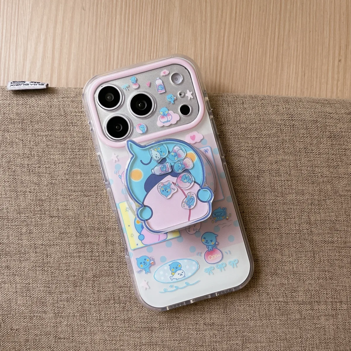 Cute blue bear clear phone case with beaded charm and pop-out grip for iPhone 17 16 15 Pro Max — MagSafe