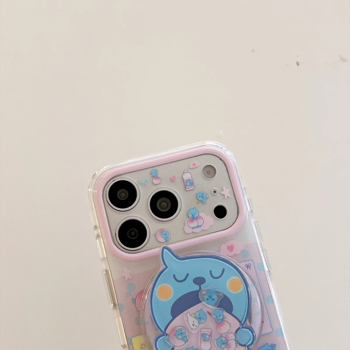 Cute blue bear clear phone case with beaded charm and pop-out grip for iPhone 17 16 15 Pro Max — MagSafe