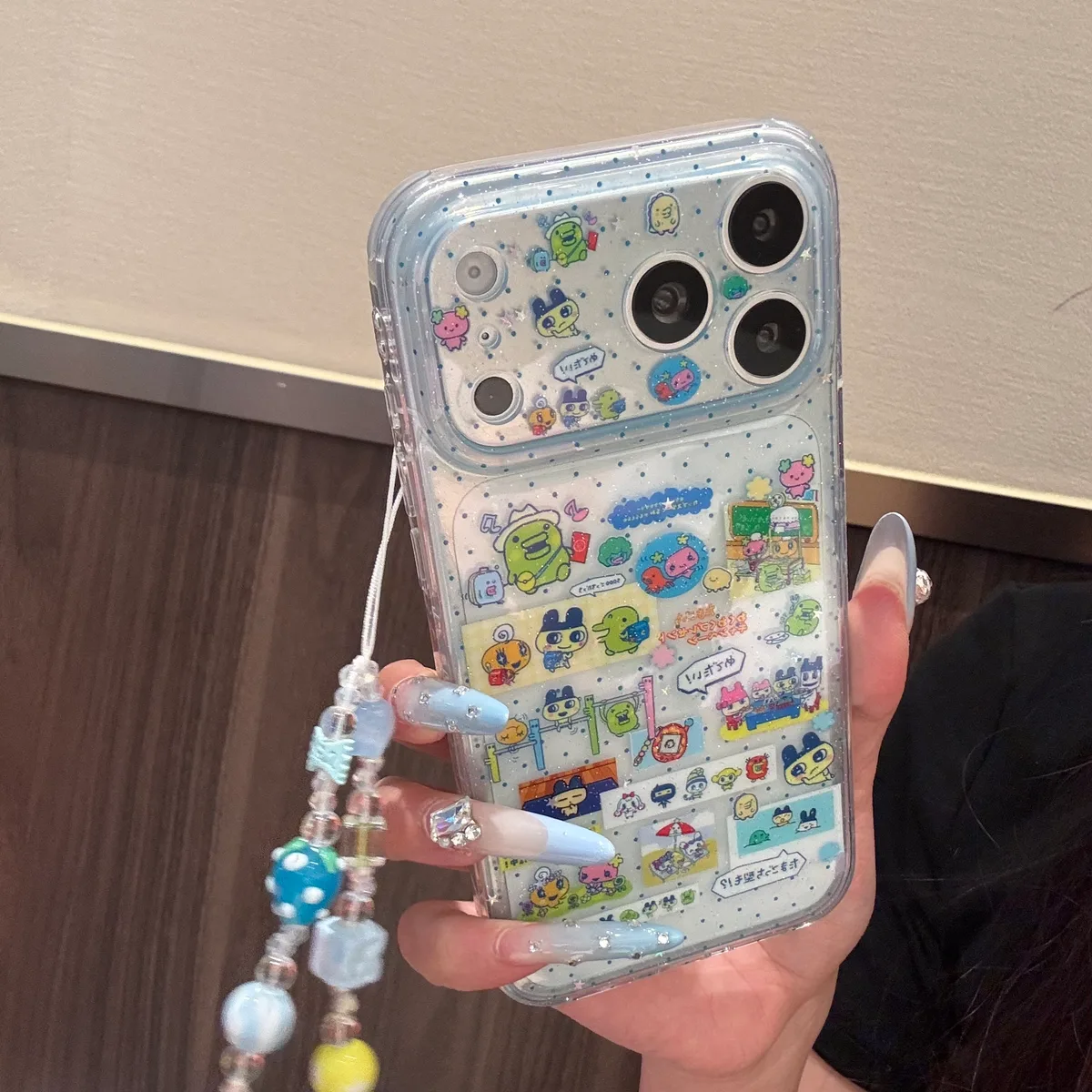 Tamagotchi 9+6 Double-Sided Glitter Case with Beaded Strap for iPhone 17 16 15 Pro Max