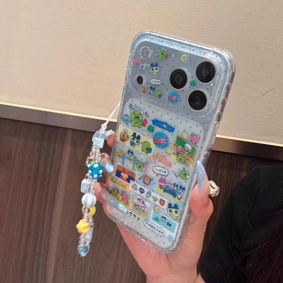 Tamagotchi 9+6 Double-Sided Glitter Case with Beaded Strap for iPhone 17 16 15 Pro Max