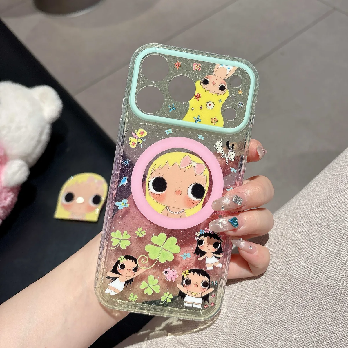 Cute glitter phone case with doll art and beaded charm strap for iPhone 17 16 15 Pro Max