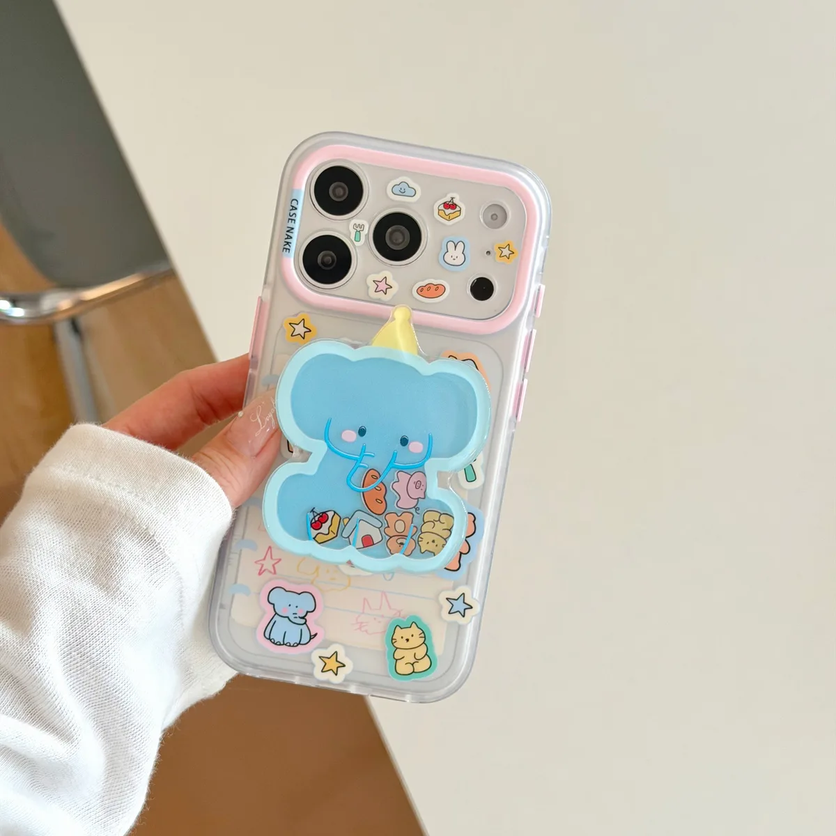 Clear pastel phone case with blue elephant charm and beaded wrist strap for iPhone 17 16 15 Pro Max