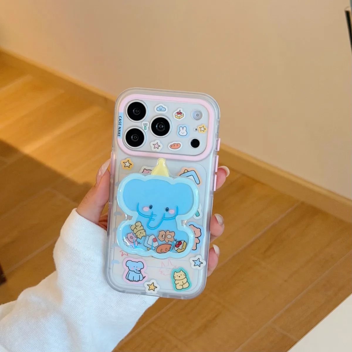 Clear pastel phone case with blue elephant charm and beaded wrist strap for iPhone 17 16 15 Pro Max