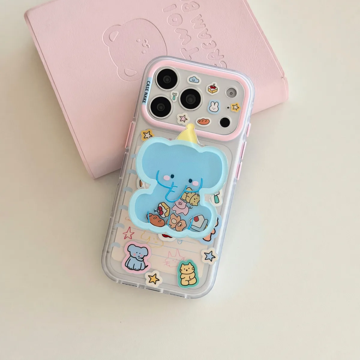 Clear pastel phone case with blue elephant charm and beaded wrist strap for iPhone 17 16 15 Pro Max