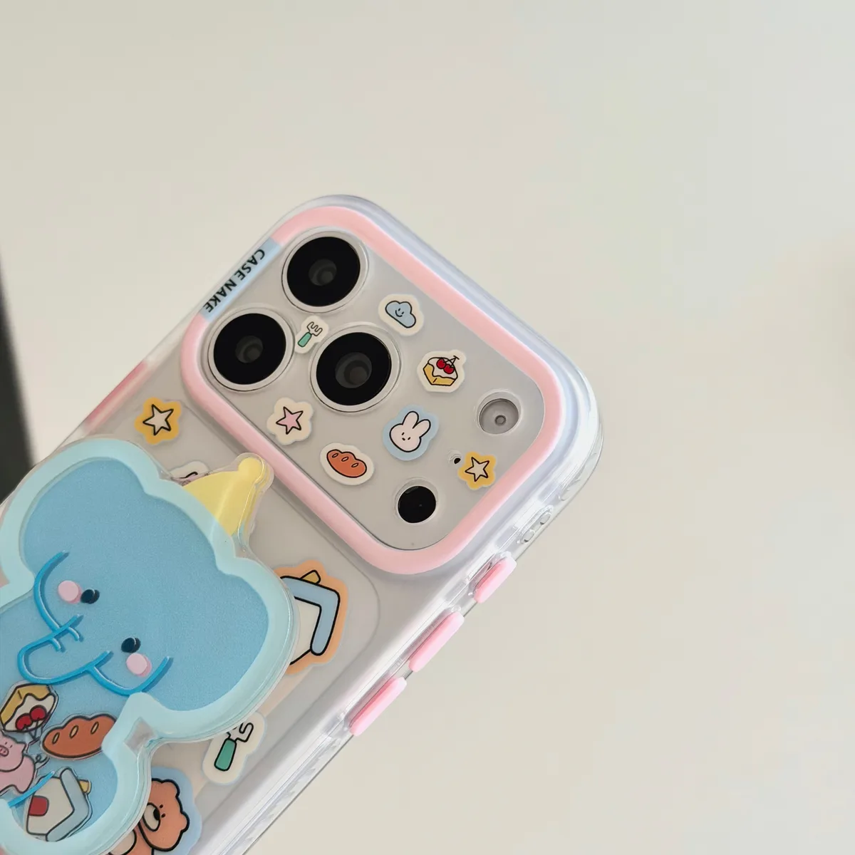 Clear pastel phone case with blue elephant charm and beaded wrist strap for iPhone 17 16 15 Pro Max