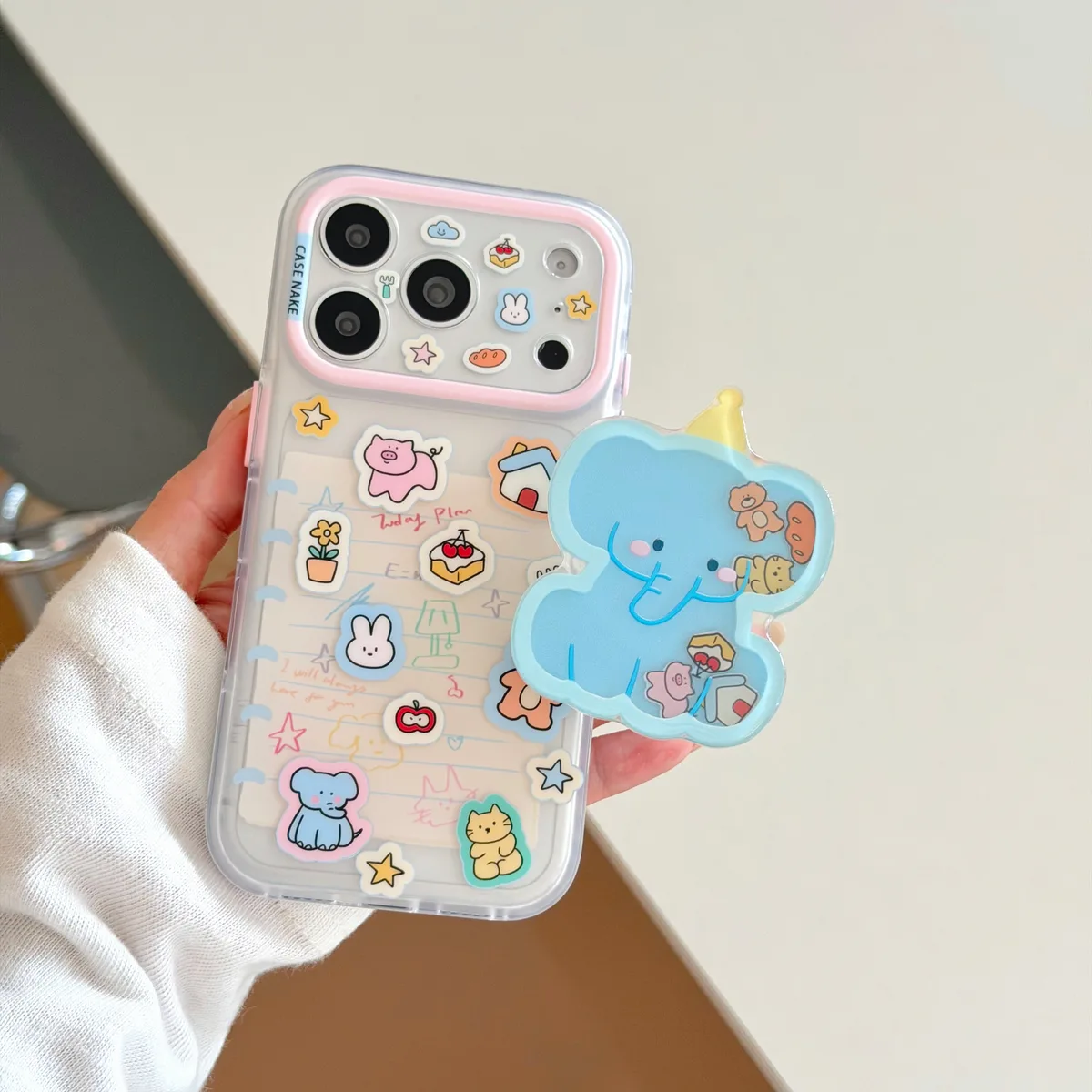 Clear pastel phone case with blue elephant charm and beaded wrist strap for iPhone 17 16 15 Pro Max