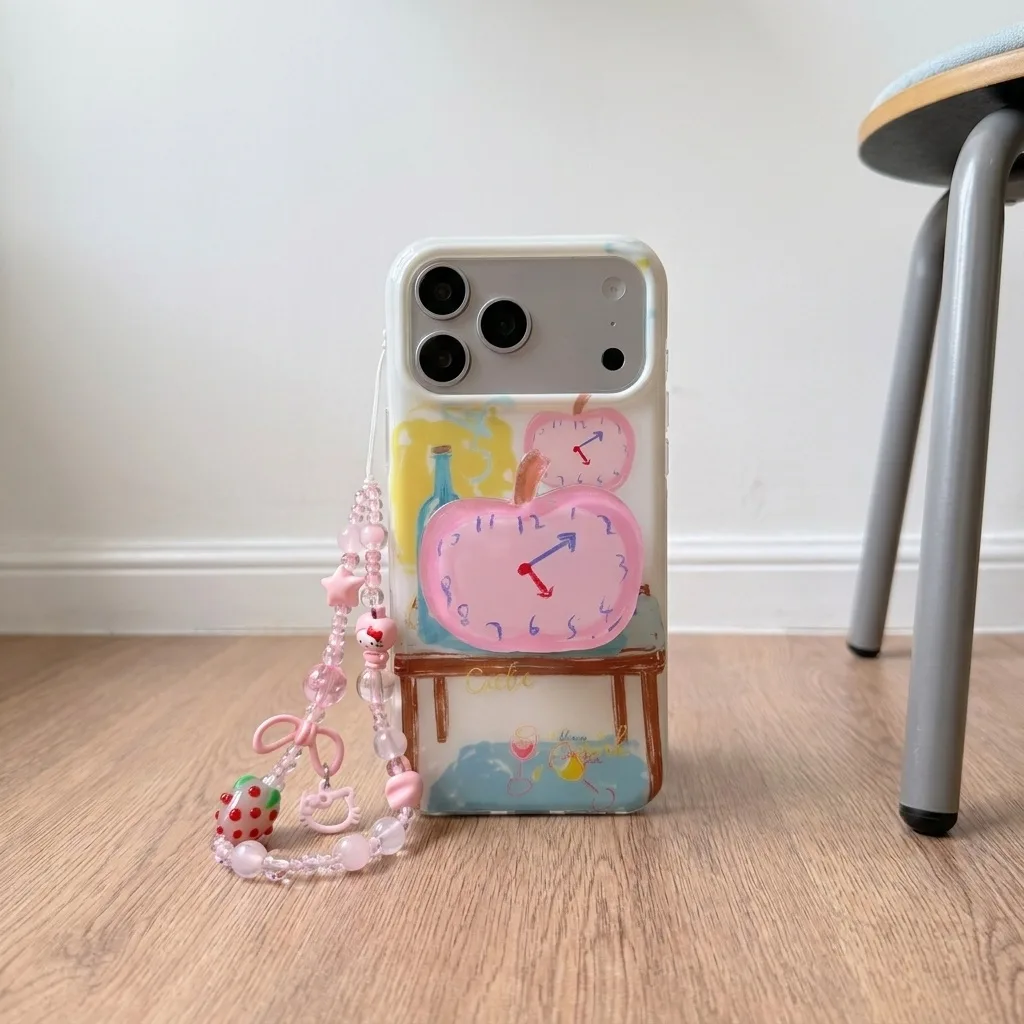Clear phone case with a pastel hand-drawn table scene and a pink beaded charm strap