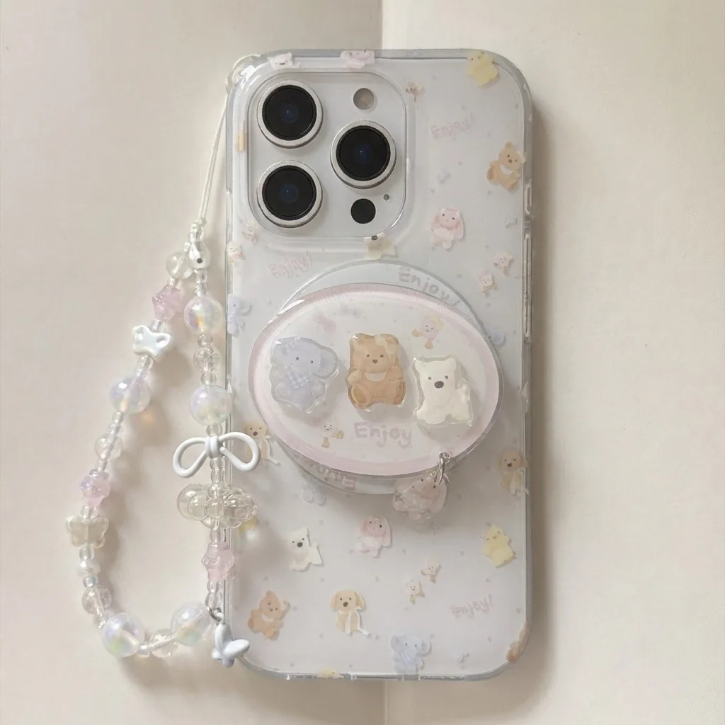 Clear phone case with pastel bear print, beaded charm strap, and round ring stand accessory