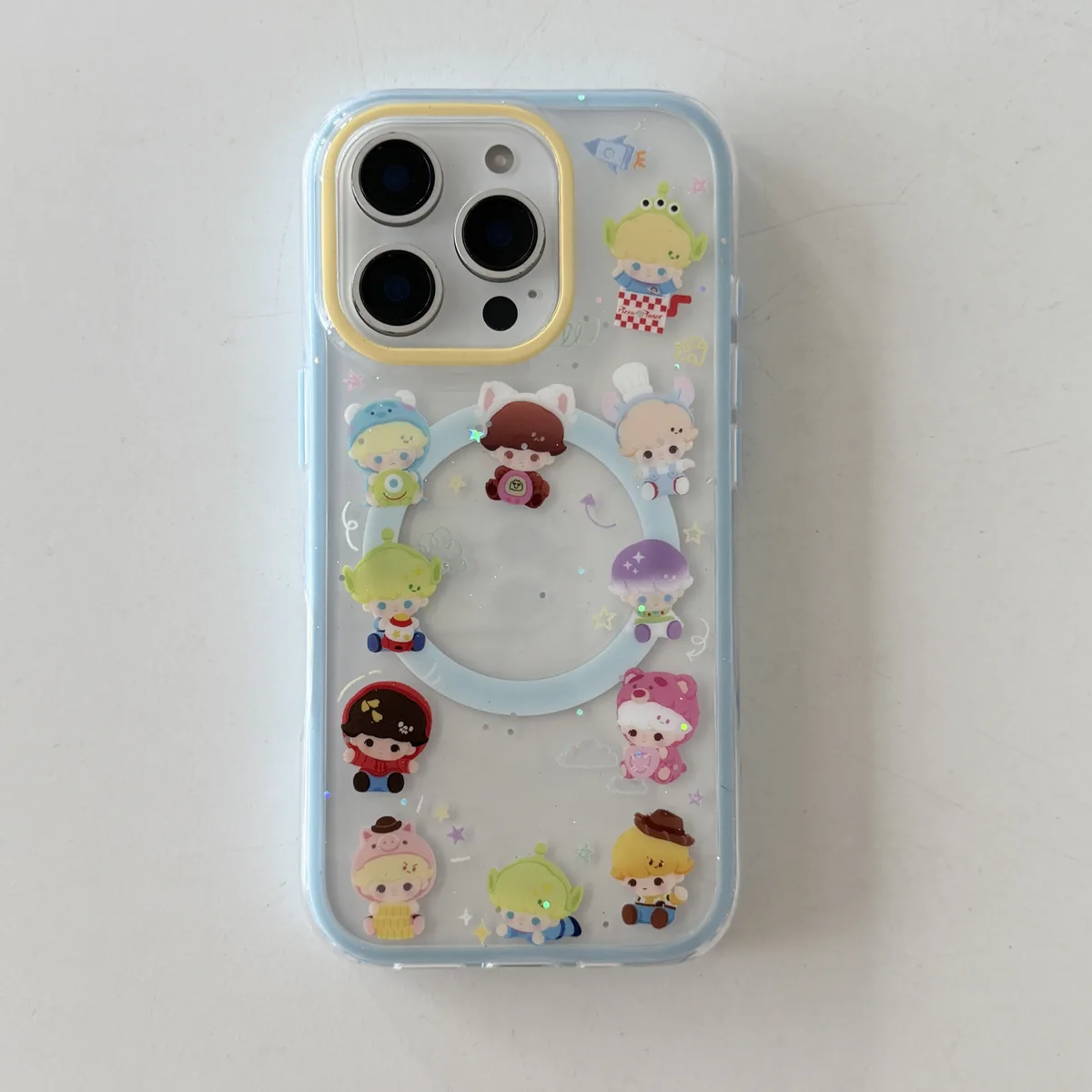 Toy Story character clear phone case with pastel charm and magnetic grip accessory for iPhone 17 16 15 Pro Max — MagSafe