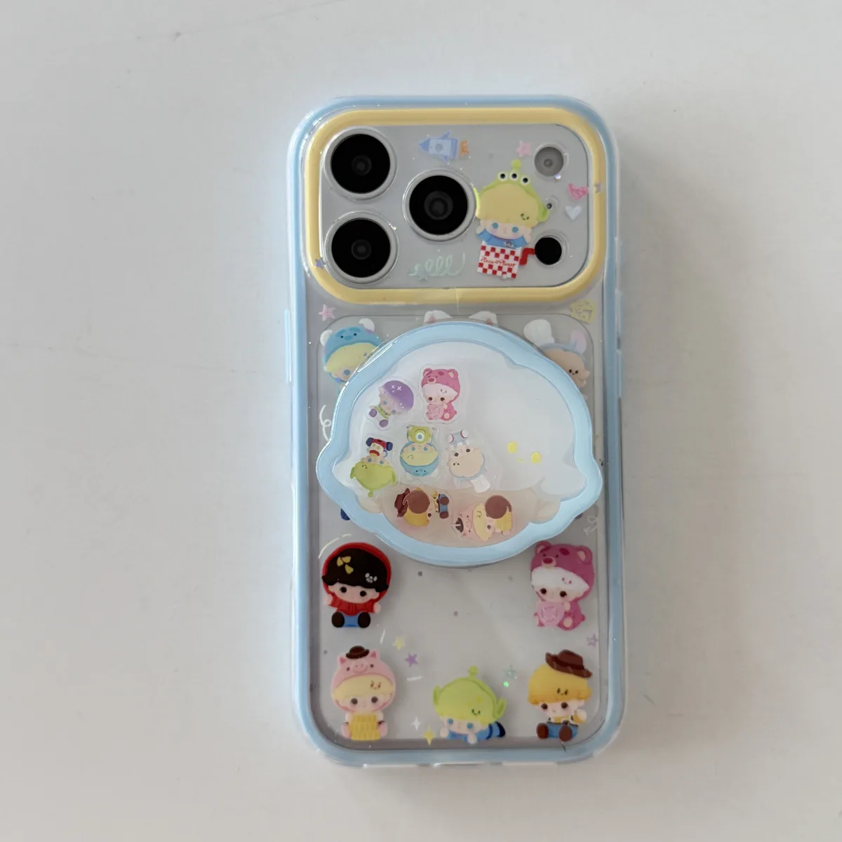 Toy Story character clear phone case with pastel charm and magnetic grip accessory for iPhone 17 16 15 Pro Max — MagSafe
