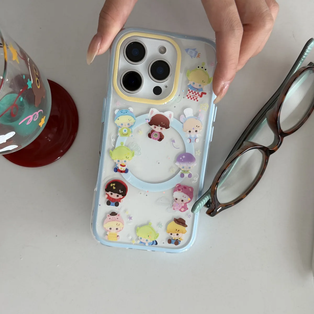 Toy Story character clear phone case with pastel charm and magnetic grip accessory for iPhone 17 16 15 Pro Max — MagSafe